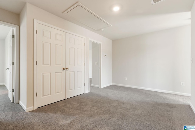 unfurnished bedroom featuring a closet and carpet