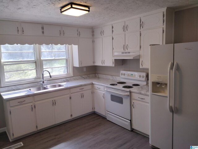 kitchen featuring white cabinets, white appliances, and sink