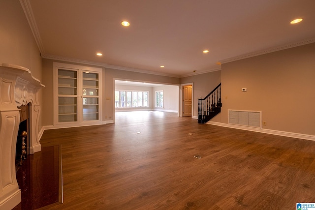 unfurnished living room with crown molding and dark hardwood / wood-style flooring