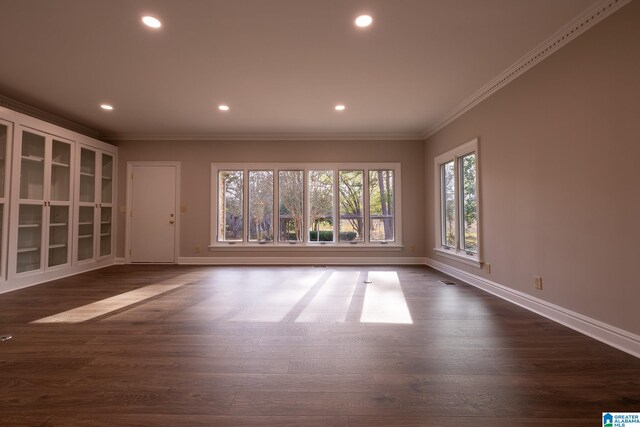 spare room with dark hardwood / wood-style floors and ornamental molding