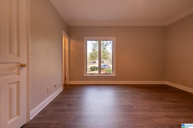 unfurnished room featuring dark hardwood / wood-style floors and ornamental molding