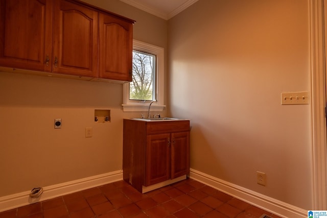 laundry area featuring electric dryer hookup, cabinets, hookup for a washing machine, dark tile floors, and sink