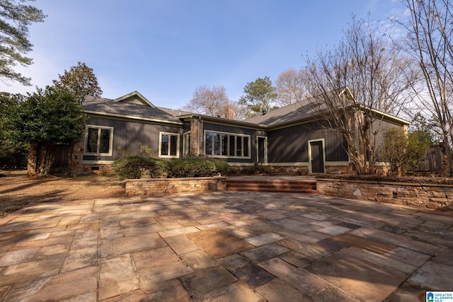 rear view of property featuring a patio area