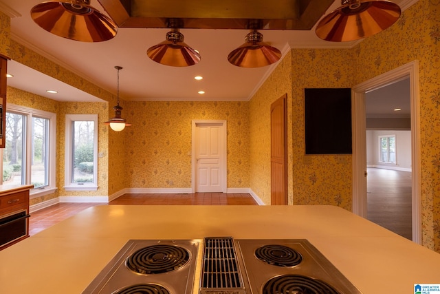 kitchen with crown molding, light hardwood / wood-style flooring, and hanging light fixtures