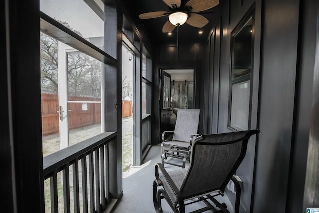 sunroom / solarium with french doors and ceiling fan