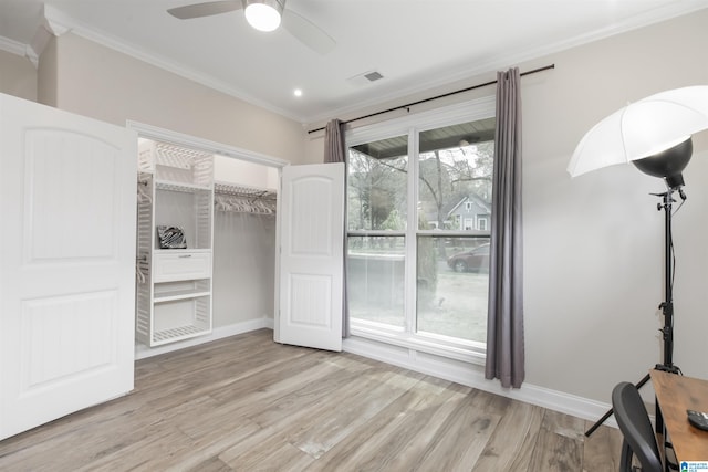 unfurnished bedroom with light hardwood / wood-style floors, ornamental molding, a closet, and ceiling fan