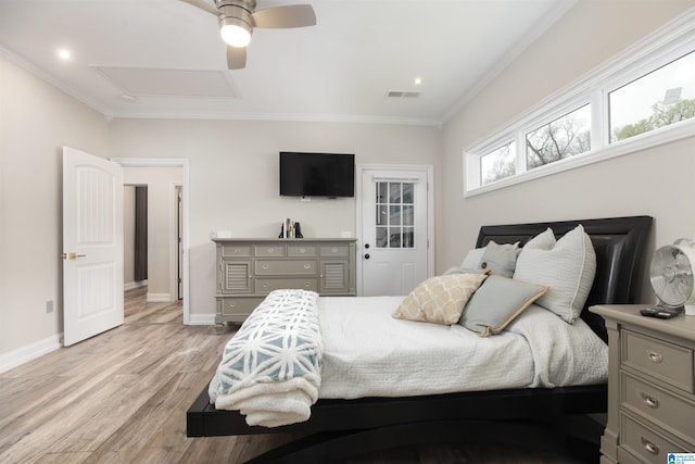 bedroom with ornamental molding, ceiling fan, and light wood-type flooring