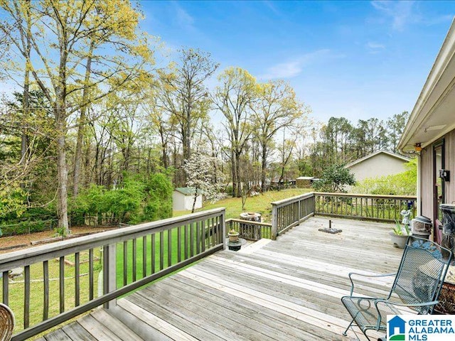 wooden terrace with a yard