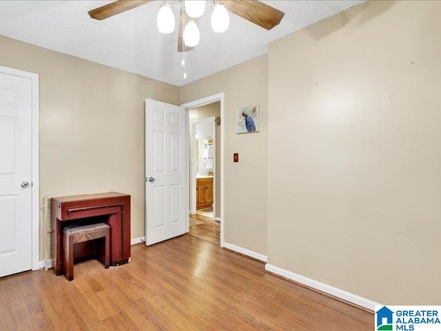 interior space featuring ceiling fan and light wood-type flooring