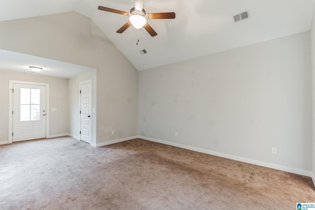 carpeted empty room featuring ceiling fan and high vaulted ceiling