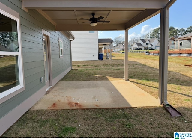 view of patio featuring a residential view and a ceiling fan