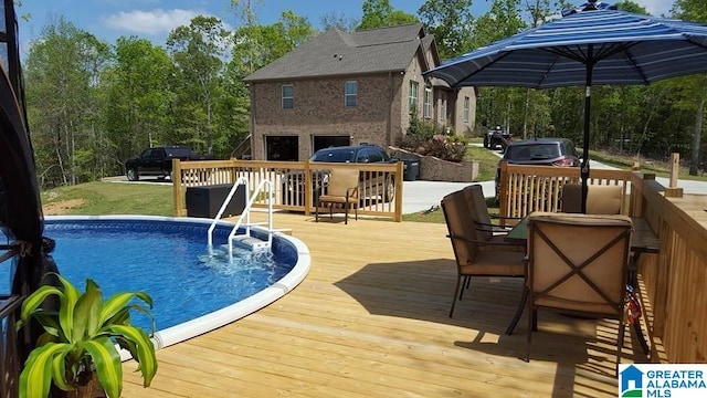 view of pool featuring a deck