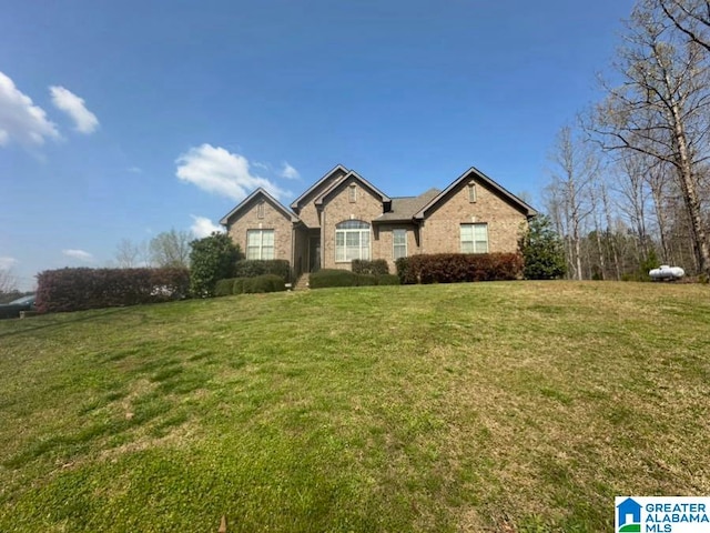 ranch-style house with a front lawn