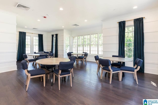 dining space featuring crown molding, visible vents, dark wood-style flooring, and recessed lighting