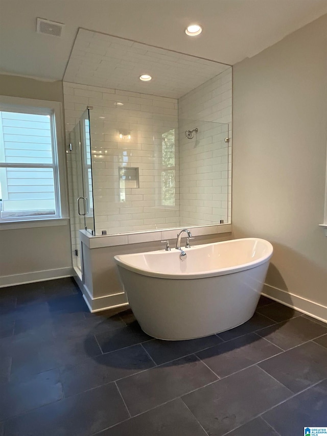 full bath featuring a stall shower, baseboards, visible vents, a soaking tub, and recessed lighting