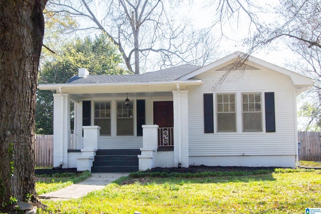 view of front of house featuring a porch and a front yard