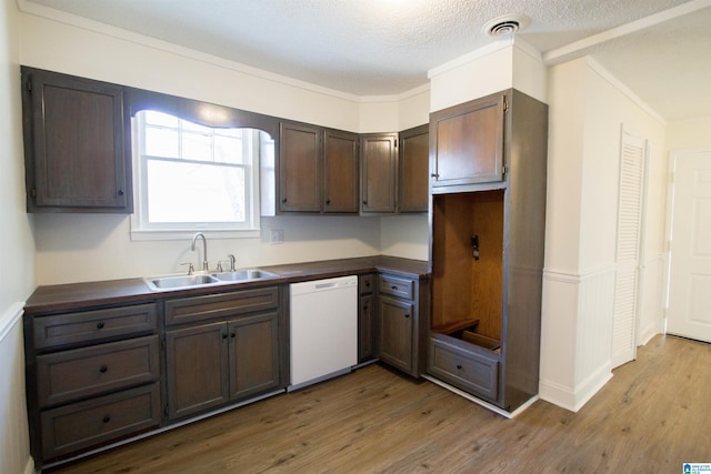 kitchen with dishwasher, sink, dark brown cabinetry, and wood-type flooring