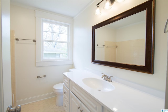 bathroom with tile floors, large vanity, and toilet