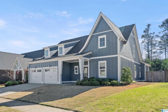 view of front of home featuring a front yard and a garage