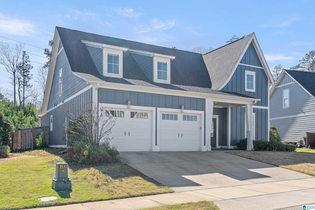 view of front of house featuring a front lawn and a garage