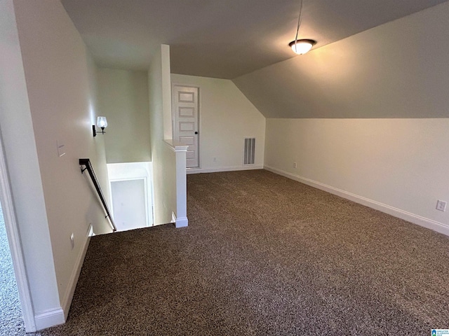 bonus room featuring vaulted ceiling, carpet flooring, visible vents, and baseboards