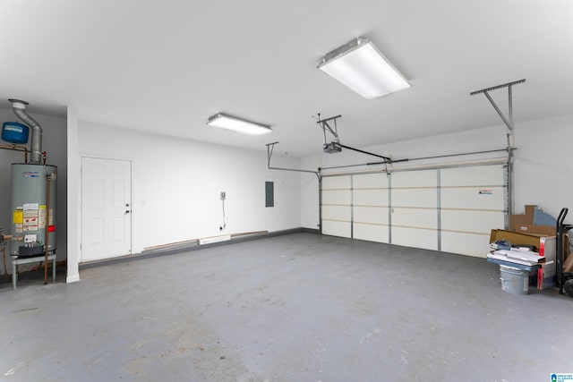 garage featuring water heater and a garage door opener