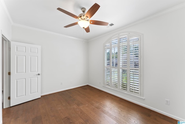 empty room with dark hardwood / wood-style floors, ceiling fan, crown molding, and plenty of natural light