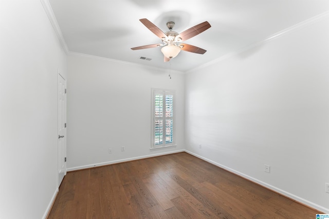 empty room with ornamental molding, ceiling fan, and dark hardwood / wood-style floors