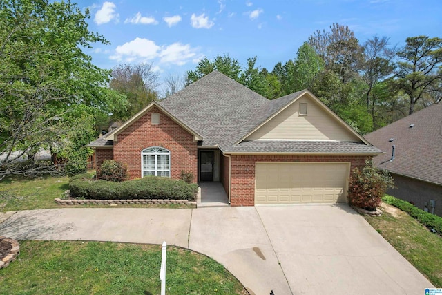 view of front of home featuring a garage and a front lawn