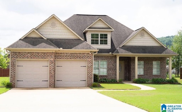 view of front of property with a garage and a front yard