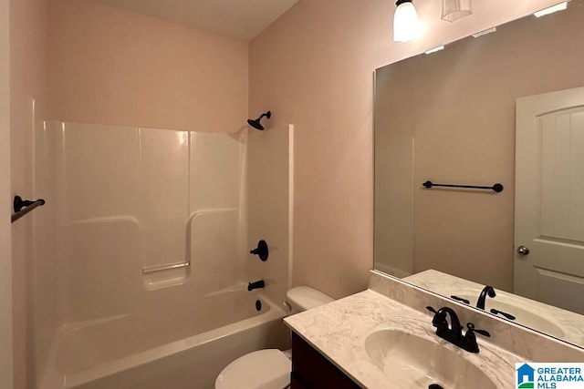 full bathroom with toilet, large vanity, and bathing tub / shower combination