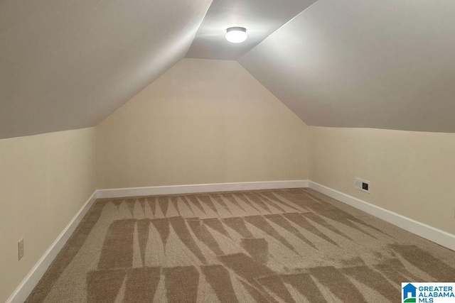 bonus room featuring carpet floors and lofted ceiling