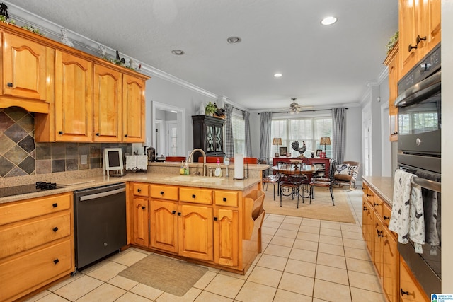 kitchen with stainless steel dishwasher, ceiling fan, kitchen peninsula, and sink