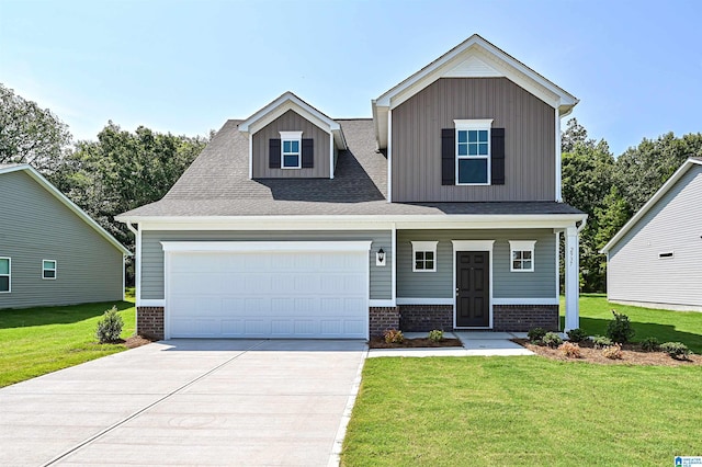 view of front of property with a front yard, a porch, and a garage