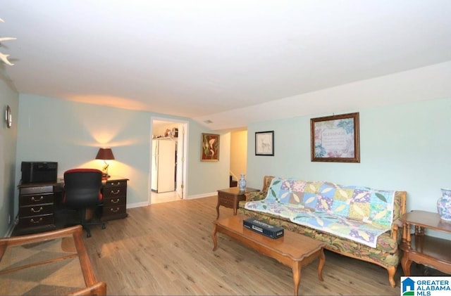 living room featuring hardwood / wood-style floors and vaulted ceiling