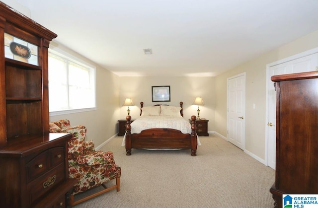 bedroom with light carpet