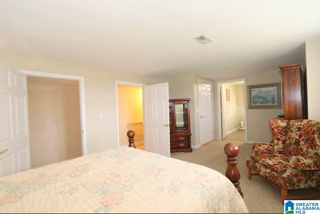 bedroom featuring light carpet