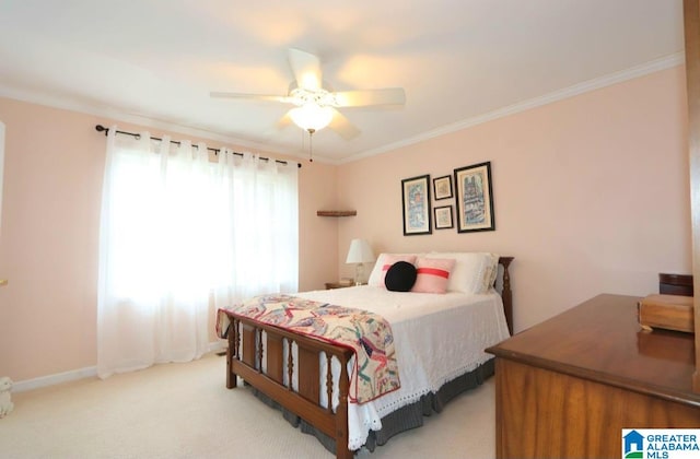 bedroom featuring ceiling fan, ornamental molding, and light carpet