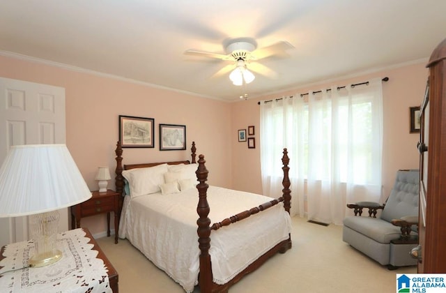 bedroom featuring light colored carpet, crown molding, and ceiling fan