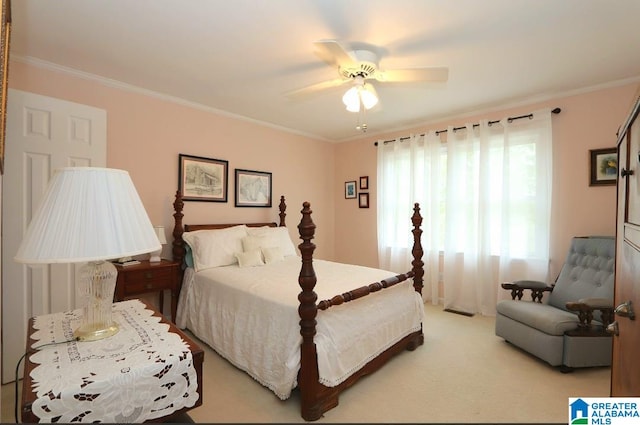 bedroom with light carpet, ceiling fan, and ornamental molding