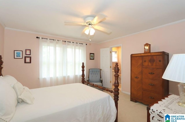 carpeted bedroom with ornamental molding and ceiling fan