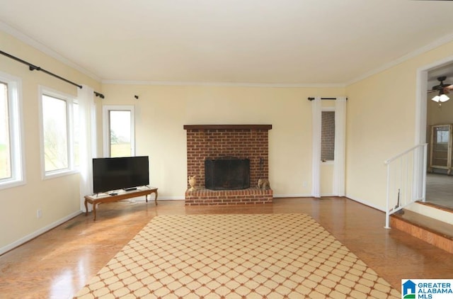 unfurnished living room with a fireplace, a healthy amount of sunlight, ceiling fan, and crown molding