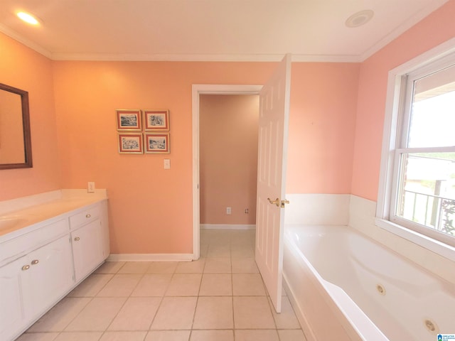 bathroom featuring a washtub, vanity, crown molding, and tile patterned floors