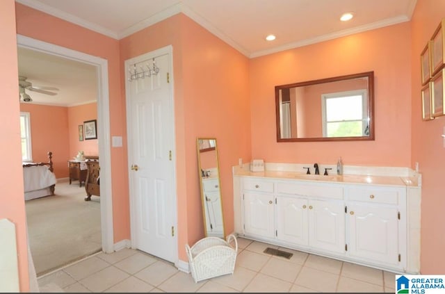 bathroom with vanity, ornamental molding, ceiling fan, and tile patterned floors