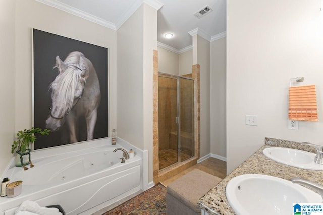 bathroom featuring ornamental molding, independent shower and bath, and dual bowl vanity