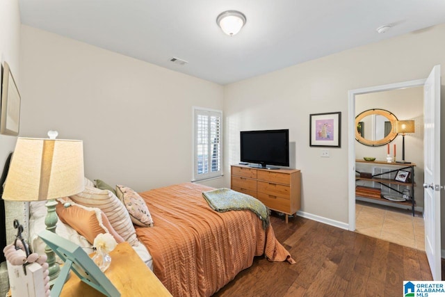 bedroom with hardwood / wood-style flooring