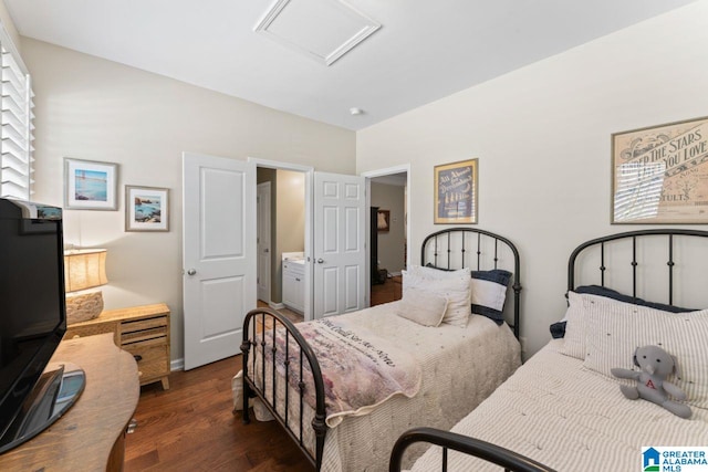 bedroom featuring dark hardwood / wood-style floors and connected bathroom