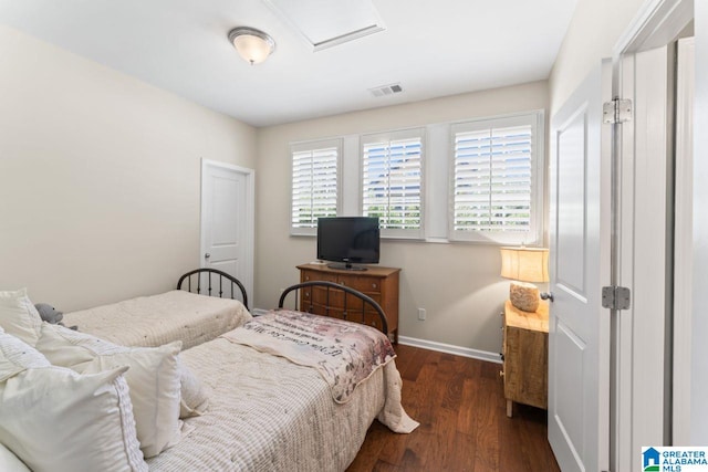 bedroom featuring dark hardwood / wood-style flooring