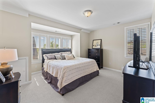 bedroom featuring light carpet