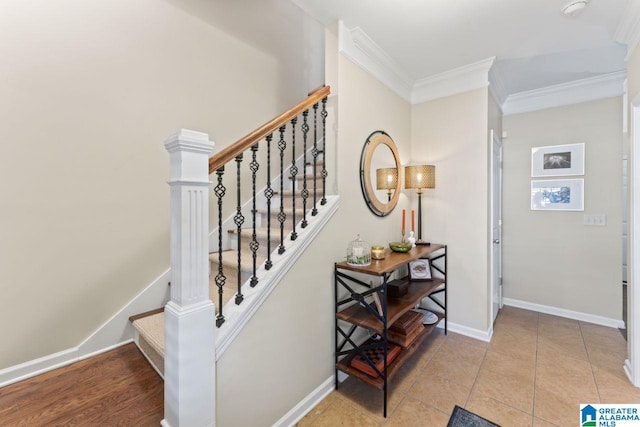 stairs with light tile floors and crown molding